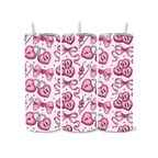 Three pink tumblers with heart and bow pattern on a white background