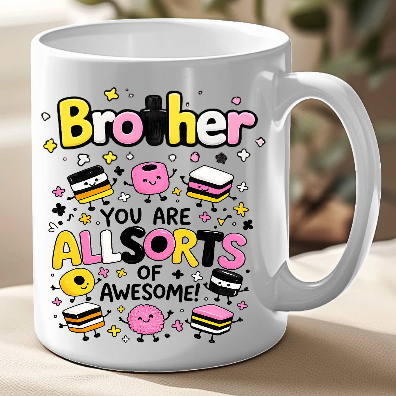 White mug with colorful text and graphics on a beige surface