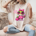 Person wearing a cream t-shirt with a cartoon character graphic and text.